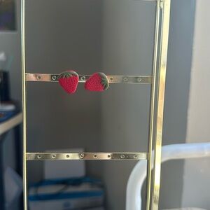 Small strawberry clay earrings. Gold metal. About 1/2 and inch.